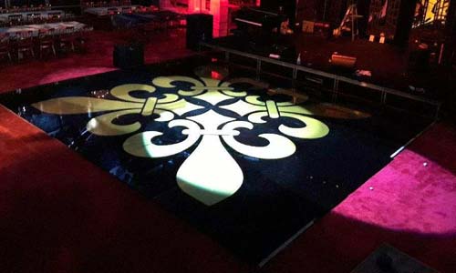 Photo of an acrylic dance floor with pattern on top. 