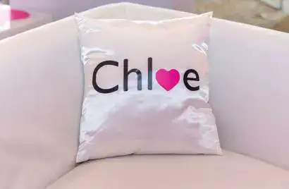White pillow features "Chloe" in a pink heart, ideal for sweet sixteen parties in New York or Long Island.